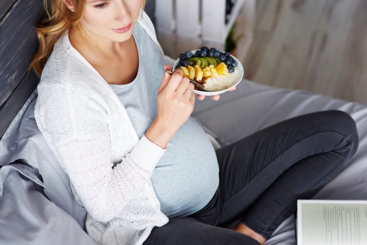 Pregnant woman relaxing at home